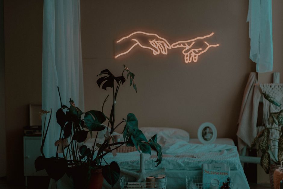 Cam performer with ring light and neon pink bedroom aesthetic