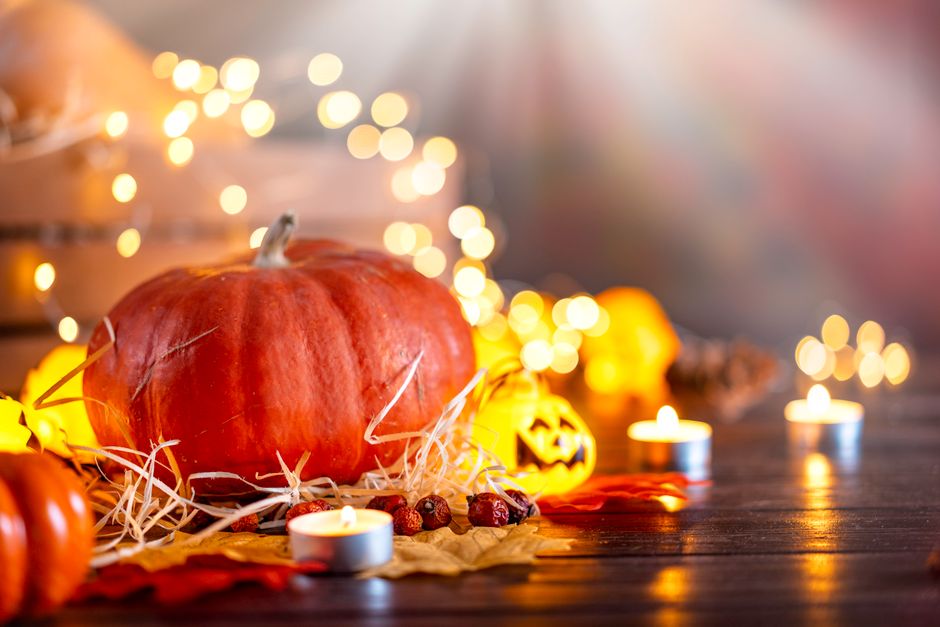 Halloween themed cam show setup with moody orange lighting