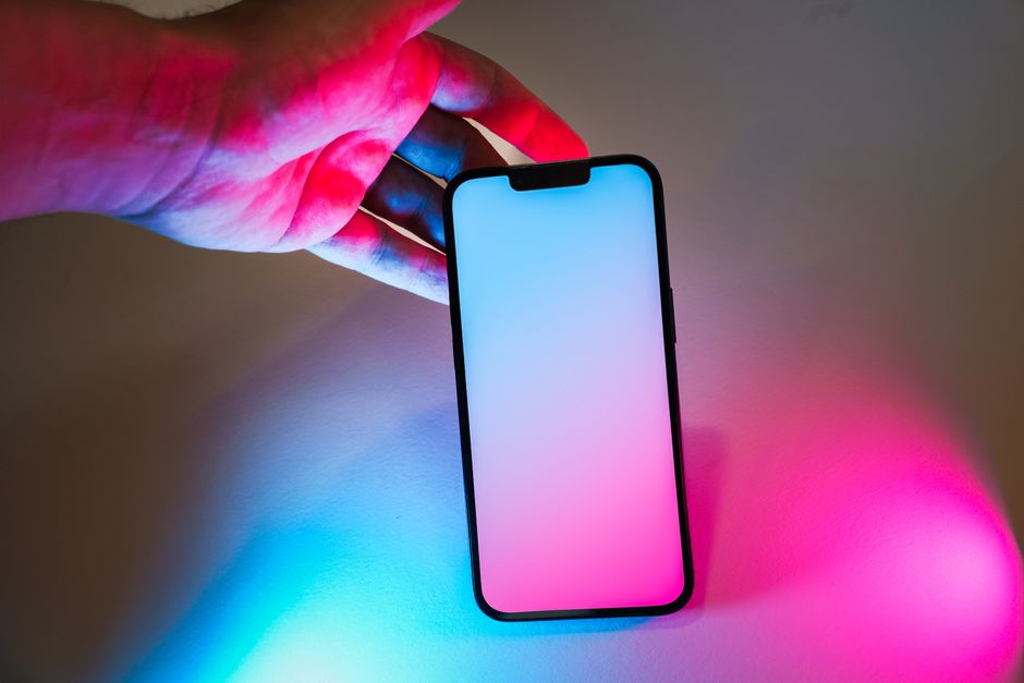 Performer navigating social media content moderation in neon-lit room