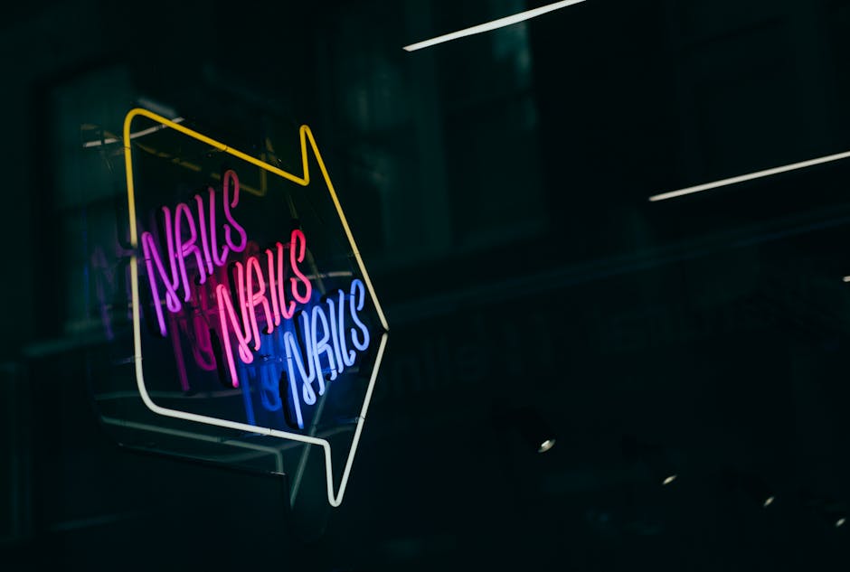 Neon-lit webcam studio with a glowing rules sign