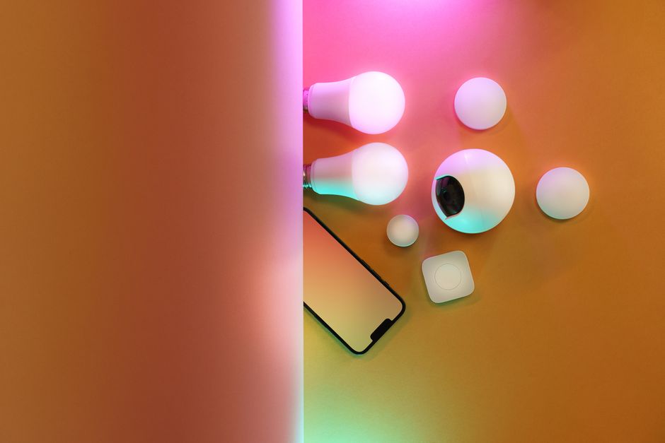 Stripchat mobile app glowing on smartphone in dark room