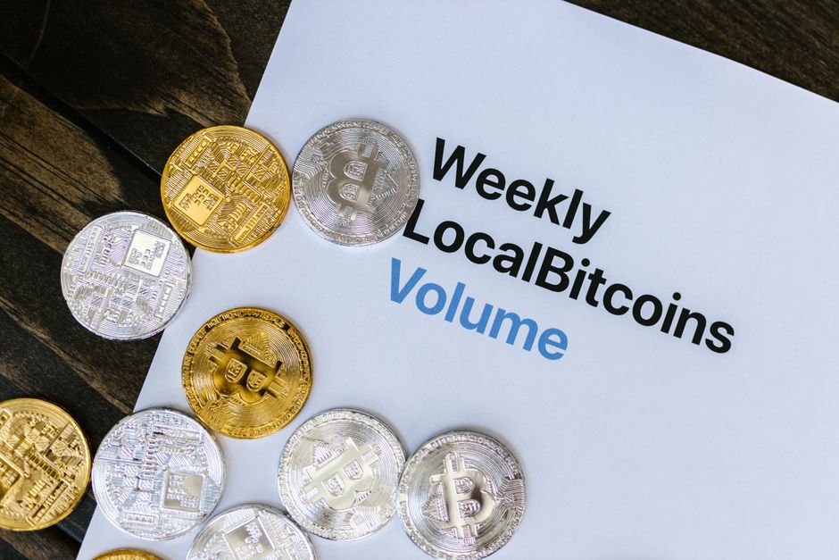 Glowing gold coins on dark luxury background representing token economy