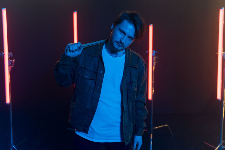 Live cam performer in neon-lit studio