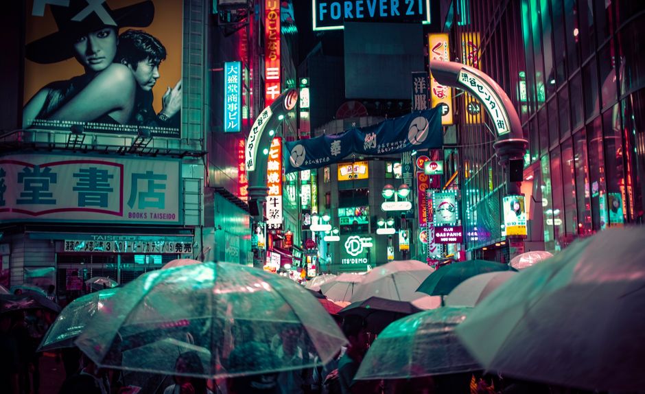 Neon-lit Tokyo street at night